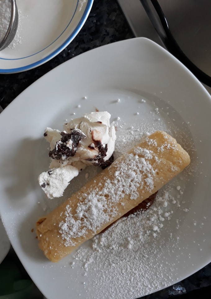 Una foto de Panqueques rellenitos de manjar
