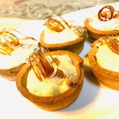 A picture of Kheer tart cups with sugar spiral.