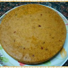 A picture of Eggless Orange N Tutti Fruity Cake.