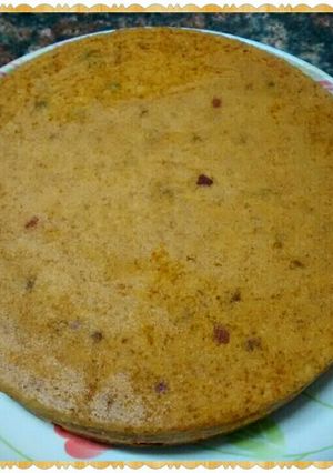 A picture of Eggless Orange N Tutti Fruity Cake.