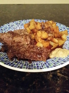 A picture of Brad's beef braised in stout with sweet potato and parsnip medly.