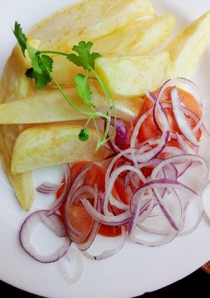 A picture of Fried potato wedges.
