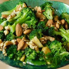 A picture of A Green Salad with Garlic- Honey sauce dressing.