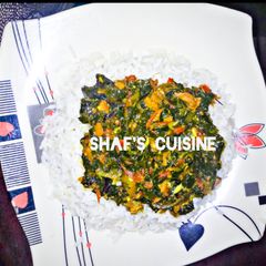 A picture of White rice with vegetable soup.