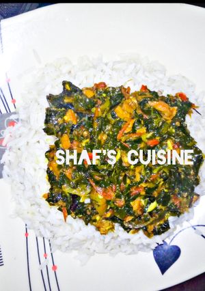 A picture of White rice with vegetable soup.