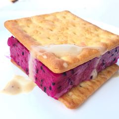 A picture of Pitaya /DragonFruit With Biscuit Top Roasted Sesame Dressing.