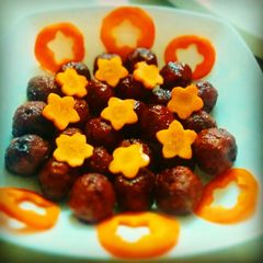 A picture of Meatballs in chilli sauce.