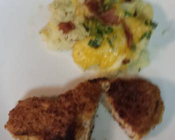 Latest Recipe Breaded pork loin chops with a side of mashed potatoes topped with bacon cheesegreen onion Yummy