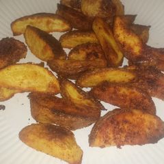 A picture of Parmesan potato wedges.