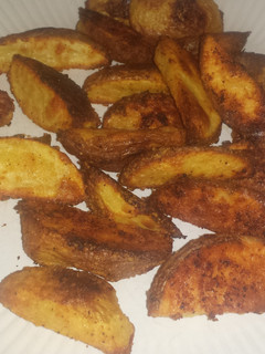 A picture of Parmesan potato wedges.