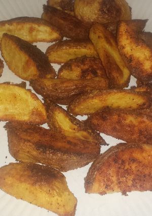 A picture of Parmesan potato wedges.