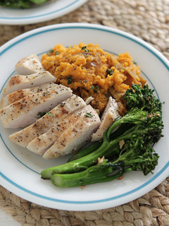 A picture of Chicken Breasts, Sorghum Sweet Potatoes, and Young Broccoli with Chipotle Orange Salt.