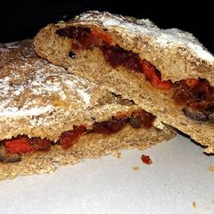 A picture of Sophie's Olive, roasted pepper and sundried tomato stuffed bread.