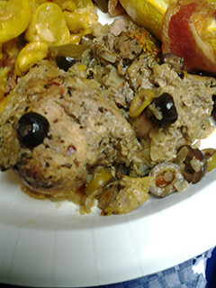 A picture of Tagine style chicken with preserved lemons.