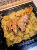 Paletilla de cordero al horno con patatas y cebolla