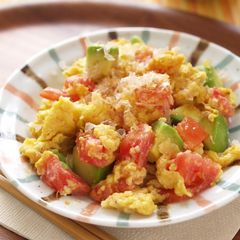 A picture of White Miso Scrambled Eggs with Tomato and Avocado.