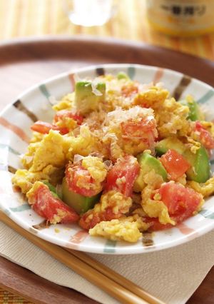 A picture of White Miso Scrambled Eggs with Tomato and Avocado.