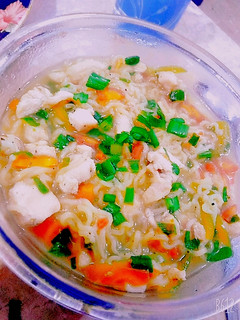 A picture of Chicken vegetables noodles with soup.