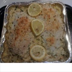 A picture of lemon chicken and herb rice.