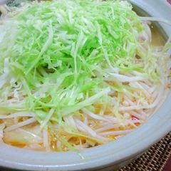 A picture of Dan Dan Noodle Hot Pot with Lots of Cabbage and Bean Sprouts.