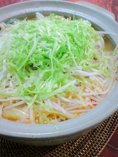 A picture of Dan Dan Noodle Hot Pot with Lots of Cabbage and Bean Sprouts.