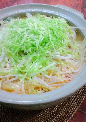 A picture of Dan Dan Noodle Hot Pot with Lots of Cabbage and Bean Sprouts.
