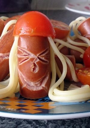 A picture of Children's Hotdog men with tomato hats.