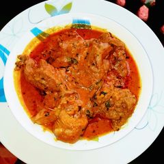 A picture of Banga soup with fresh cat fish and beef.
