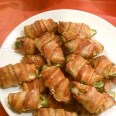 A picture of Ground Pork and Cheese Stuffed Jalapeño Peppers Wrapped in Bacon.