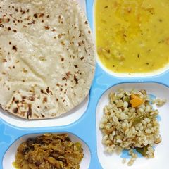 A picture of Toor Dal/Barley Khichdi and a Cabbage.