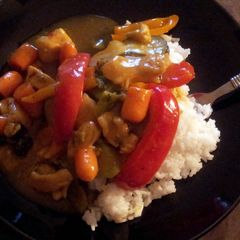 A picture of Sweet & sour Chicken curry stir fry W/ rice.