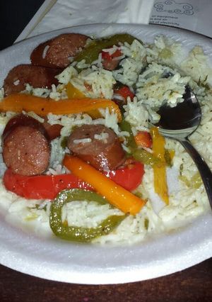 A picture of Rice with sausage and peppers.
