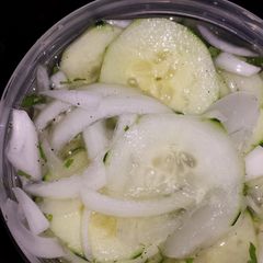 A picture of Cucumbers & onions.
