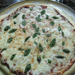 A picture of Pizza dough with beer.