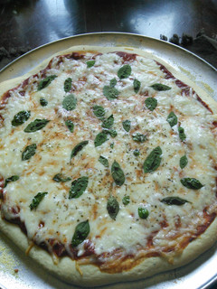 A picture of Pizza dough with beer.
