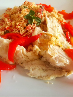 Una foto de Bifes merluza con morrón encurtido y cous cous