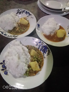 A picture of Coconut rice /wali wa nazi.with peas potatoes stew.