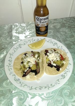 A picture of Carne asada tacos al mojo Lemon.