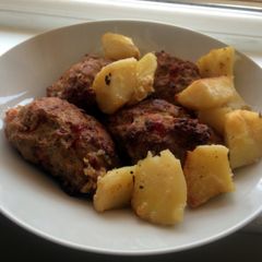 A picture of Oven baked turkey burgers and potatoes.