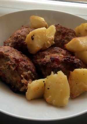 A picture of Oven baked turkey burgers and potatoes.