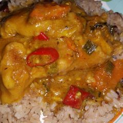A picture of Slow cooker curry chicken and easy rice and peas.