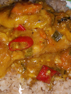 A picture of Slow cooker curry chicken and easy rice and peas.