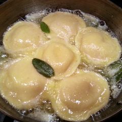 A picture of Thanksgiving Pumpkin Raviolis w/Sage Butter Sauce & Pumpkin Spice Martini.