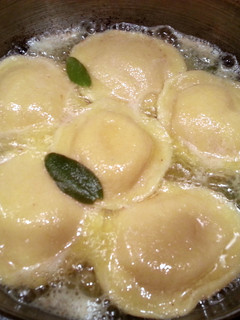 A picture of Thanksgiving Pumpkin Raviolis w/Sage Butter Sauce & Pumpkin Spice Martini.