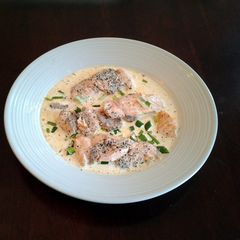 A picture of Salmon cutlets with lemon chive cream sauce.