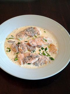 A picture of Salmon cutlets with lemon chive cream sauce.