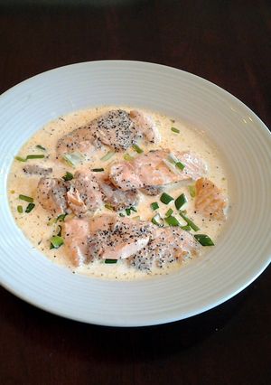 A picture of Salmon cutlets with lemon chive cream sauce.