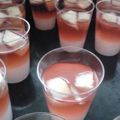 A picture of Whipped cream and sangria jello shots.
