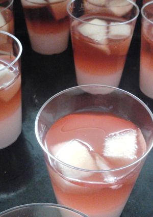 A picture of Whipped cream and sangria jello shots.