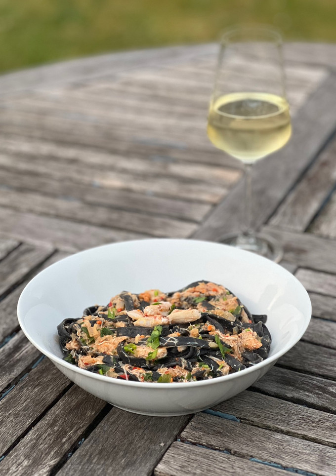 A picture of Tagliolini al nero di seppia con granchio – Venetian squid ink tagliolini with crab.
